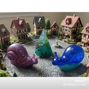 Purple and Blue Snail Figurines with Green Tree